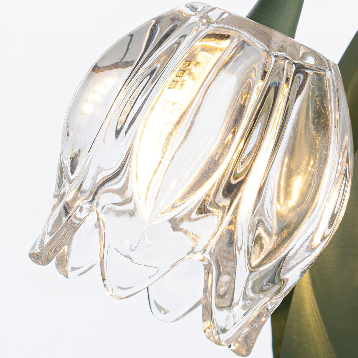 Close-up of illuminated crystal-style glass blossom shade