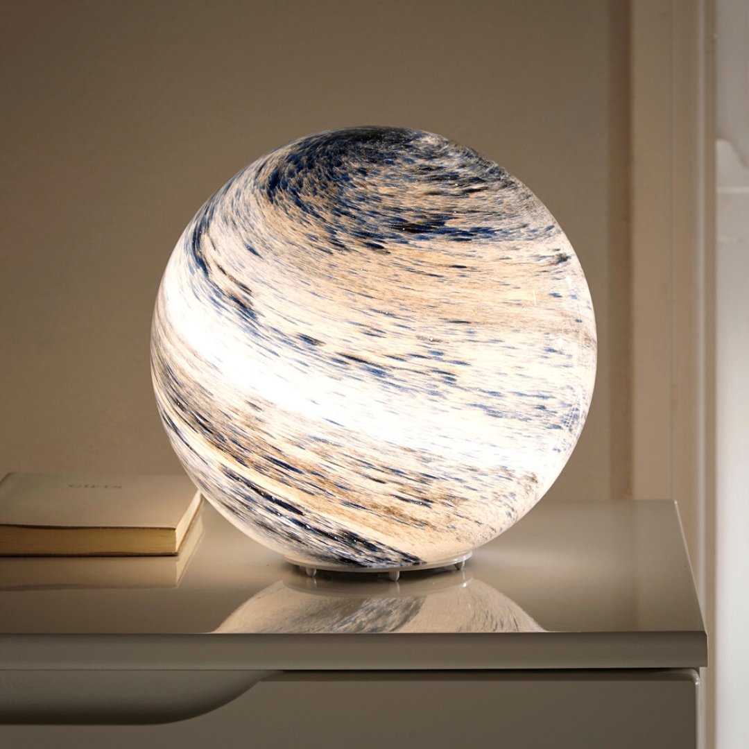 Glass moon table lamp with cosmic detailing and soft ambient light
