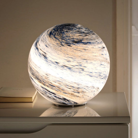 Glass moon table lamp with cosmic detailing and soft ambient light
