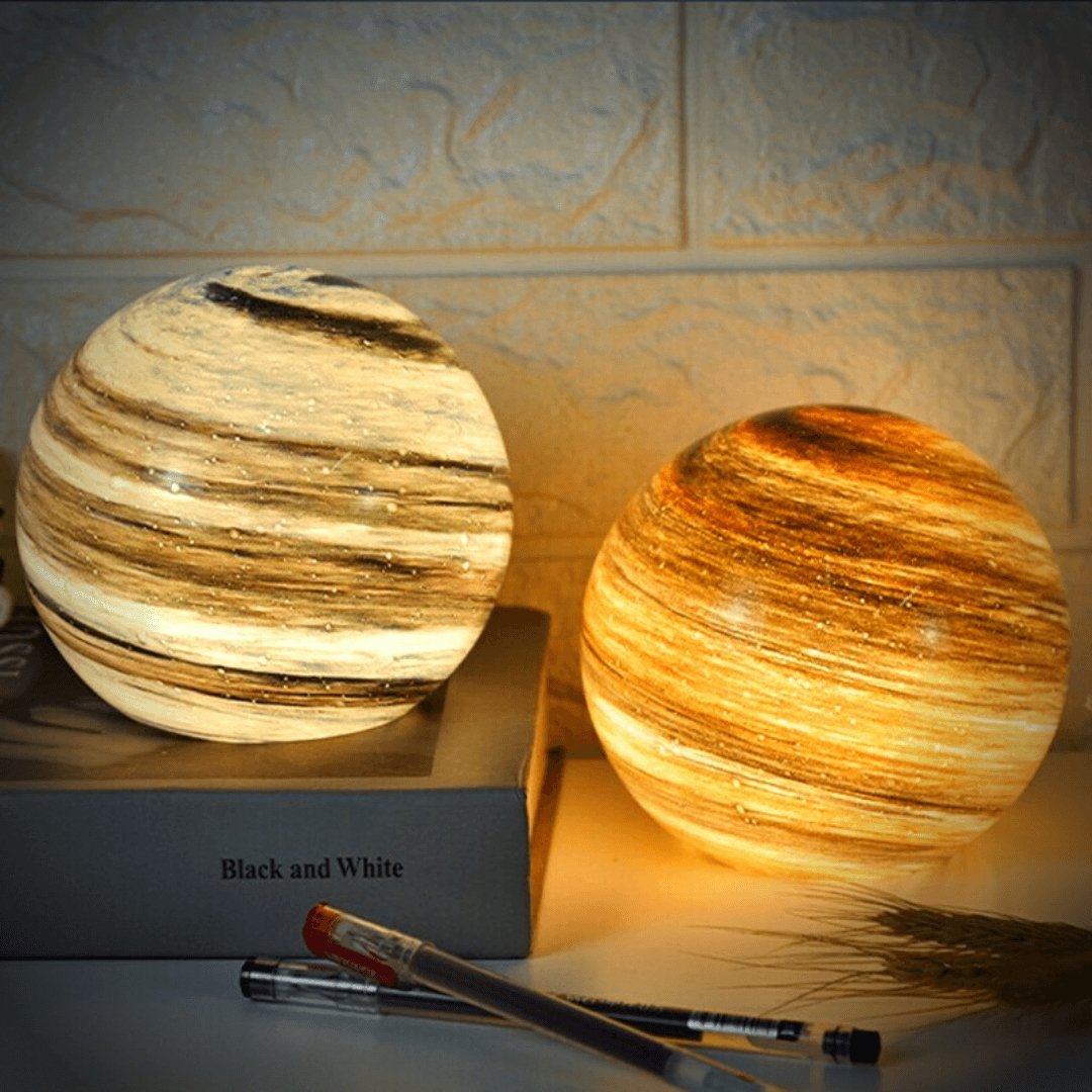 Glass moon lamps glowing in warm colour tones