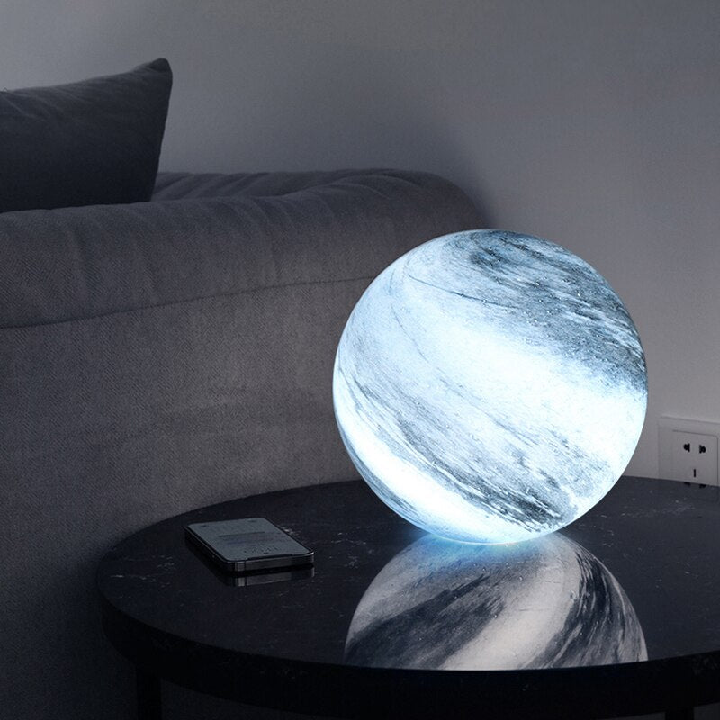 Cool glowing glass moon table lamp on a side table