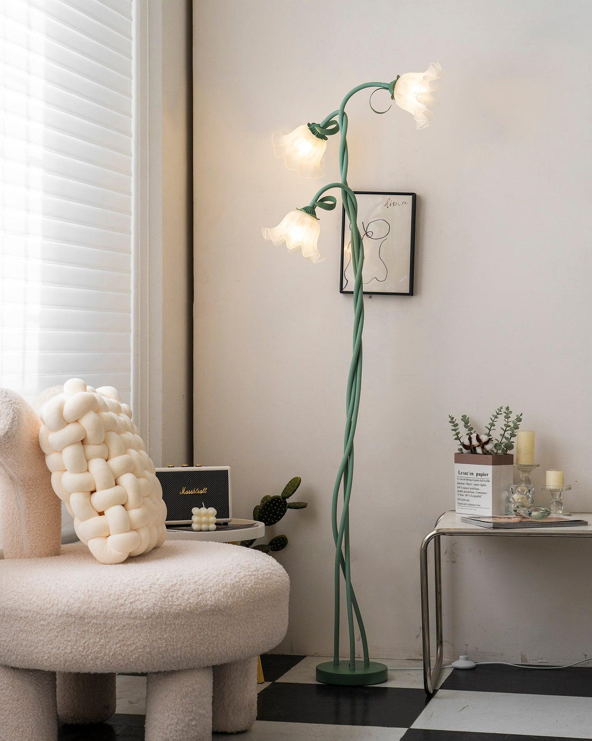 Two-head flower floor lamp beside a chair and cabinet