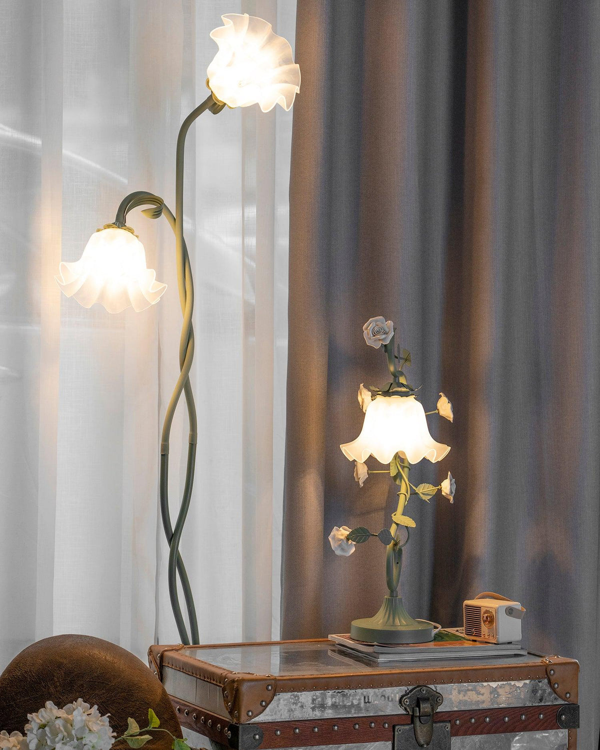 Two-head flower lamp beside a window and side table