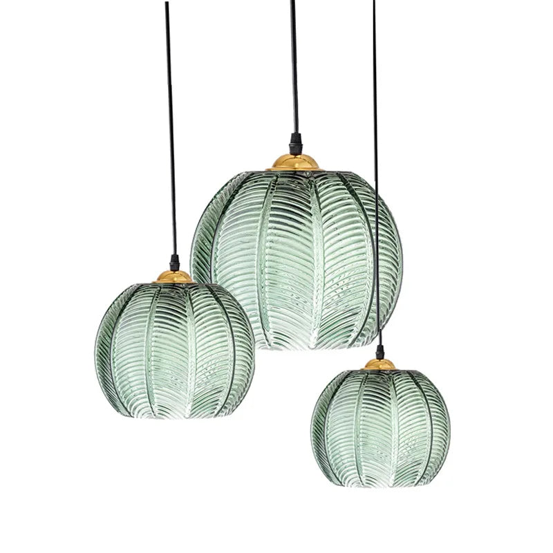 Green glass pendant light with gold detail