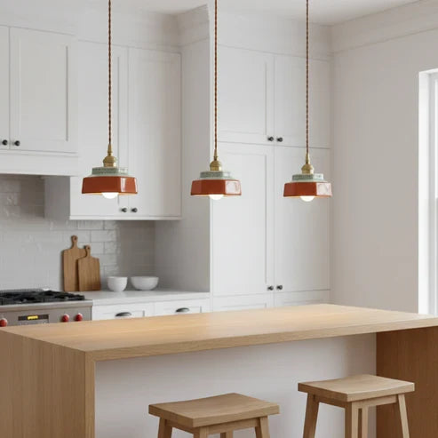 Red ceramic pendants above a kitchen island