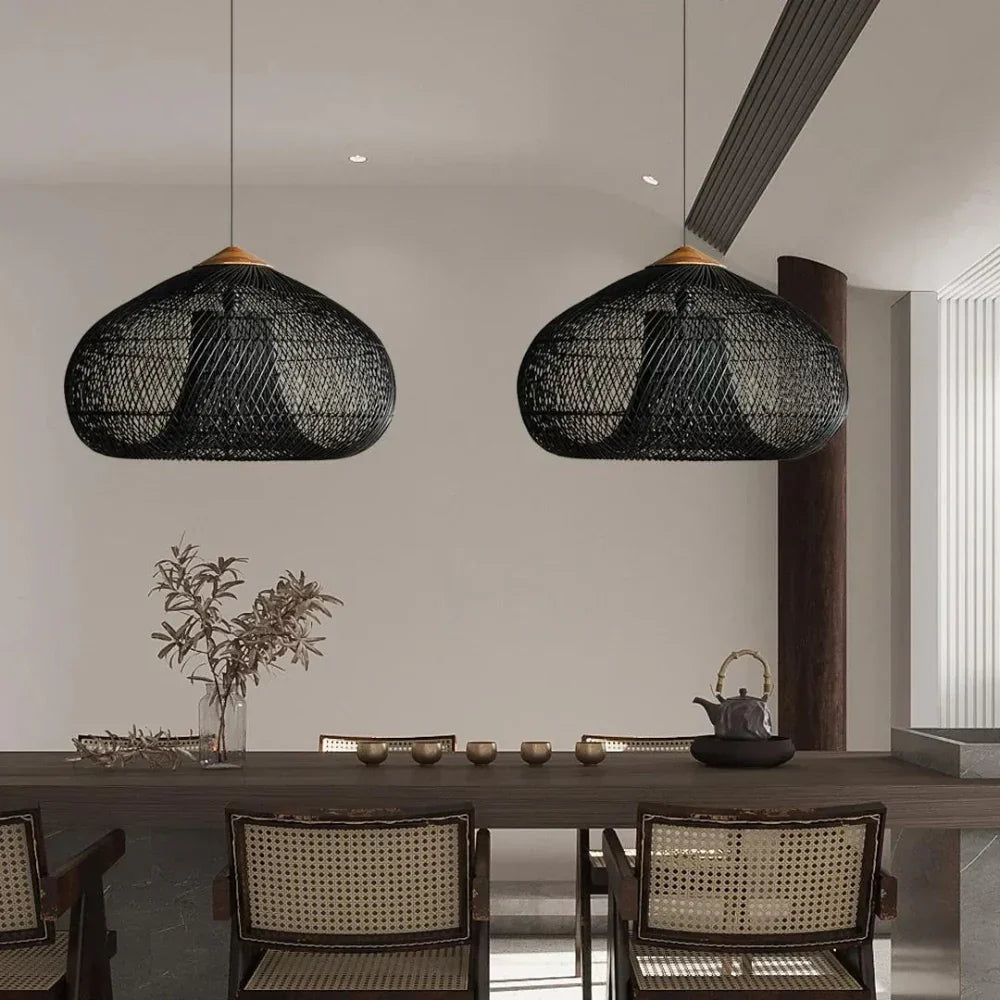 Black rattan dome pendants in a dining room