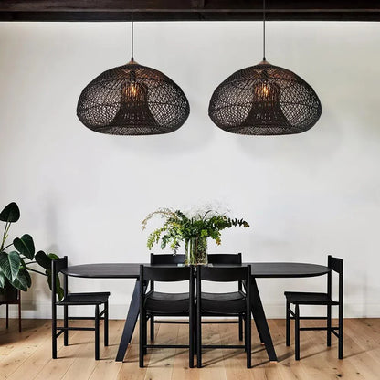 Two dark woven dome pendants above a round table