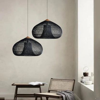 Two black rattan dome pendants in an interior