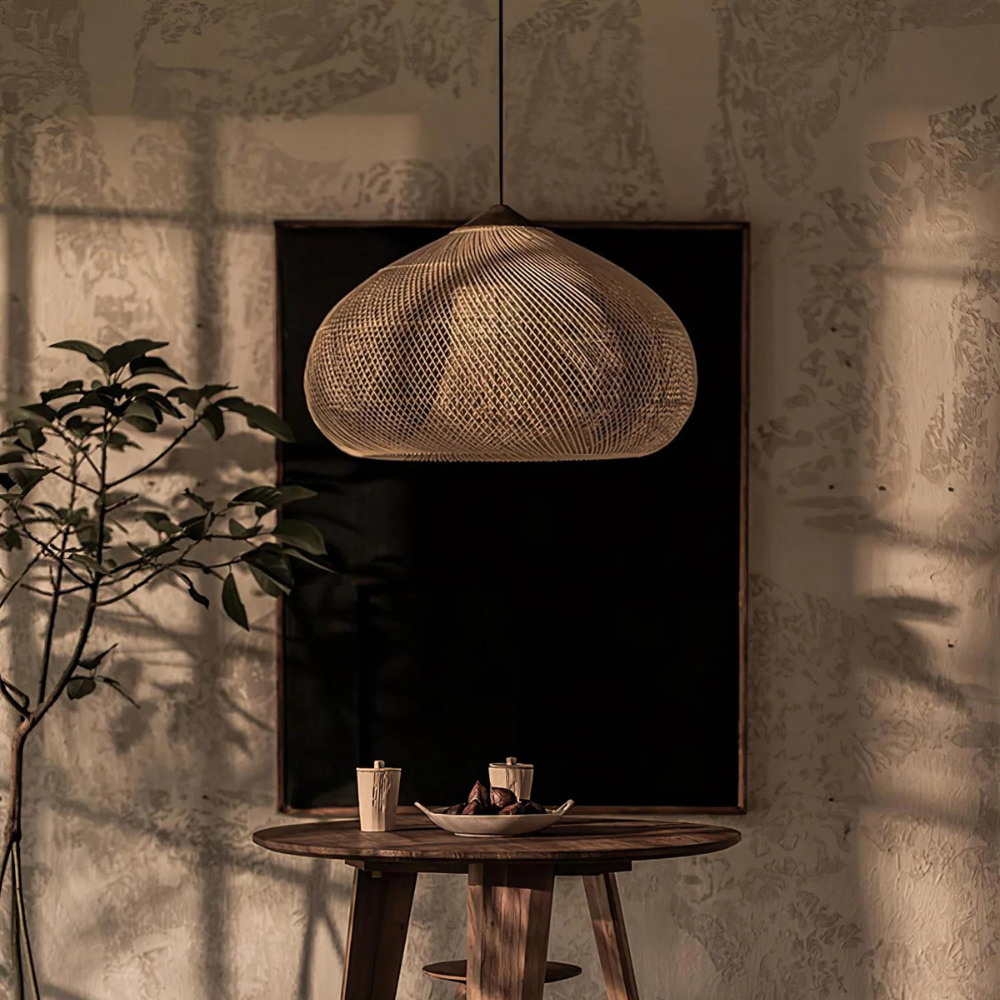 Brown rattan pendant above a small table