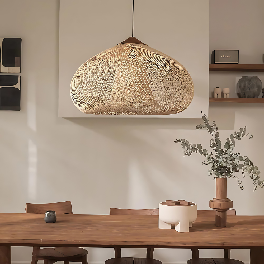 White rattan dome pendant above a dining table