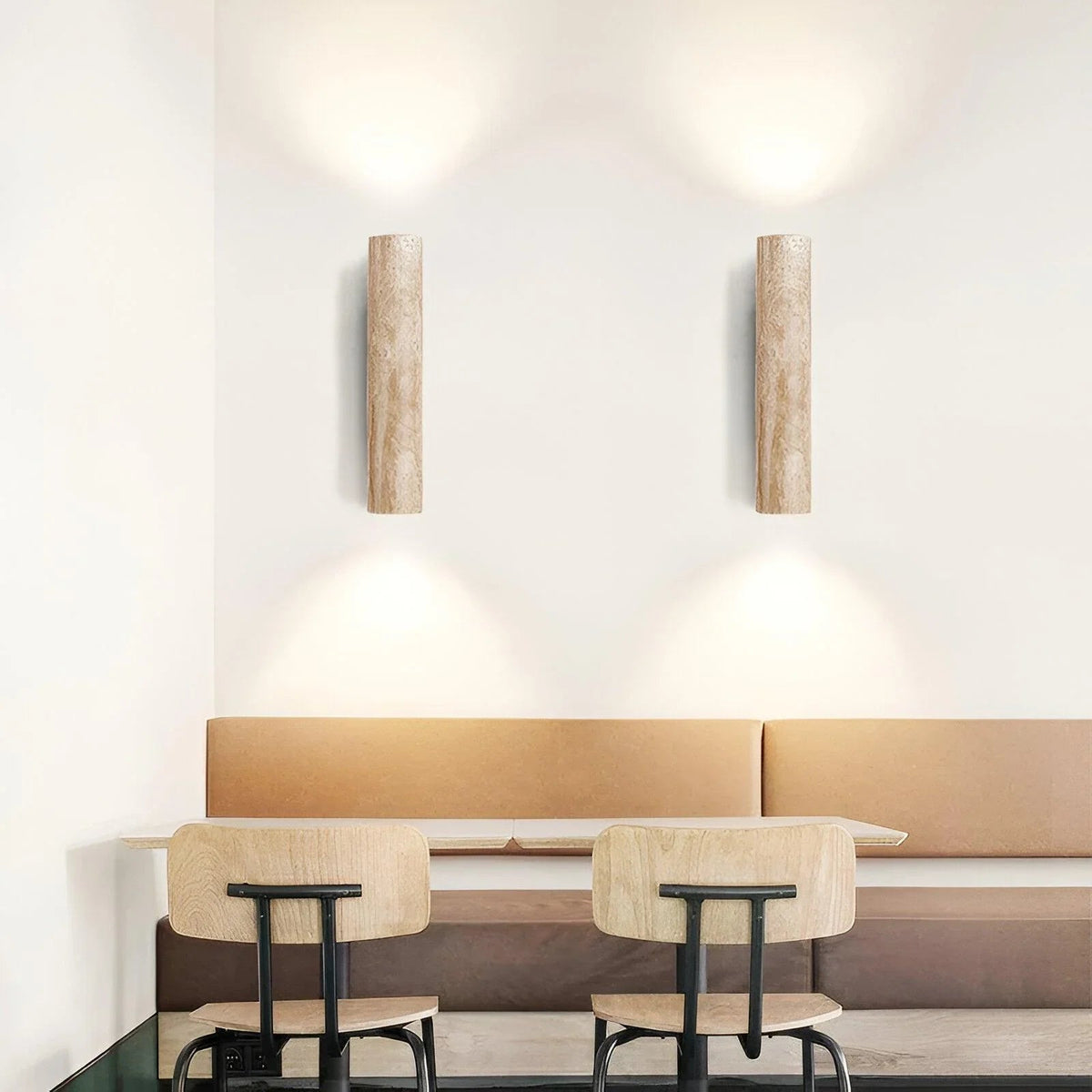 Pair of stone cylinder wall lights in a dining area