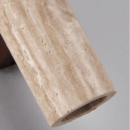 Close-up of natural travertine texture and open cylinder end
