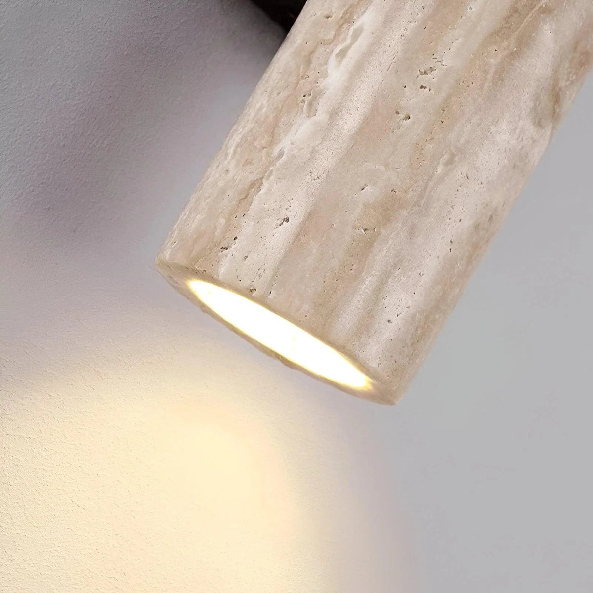Close-up of illuminated opening in a travertine wall light