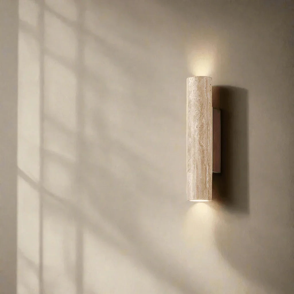 Natural stone wall light casting light above and below
