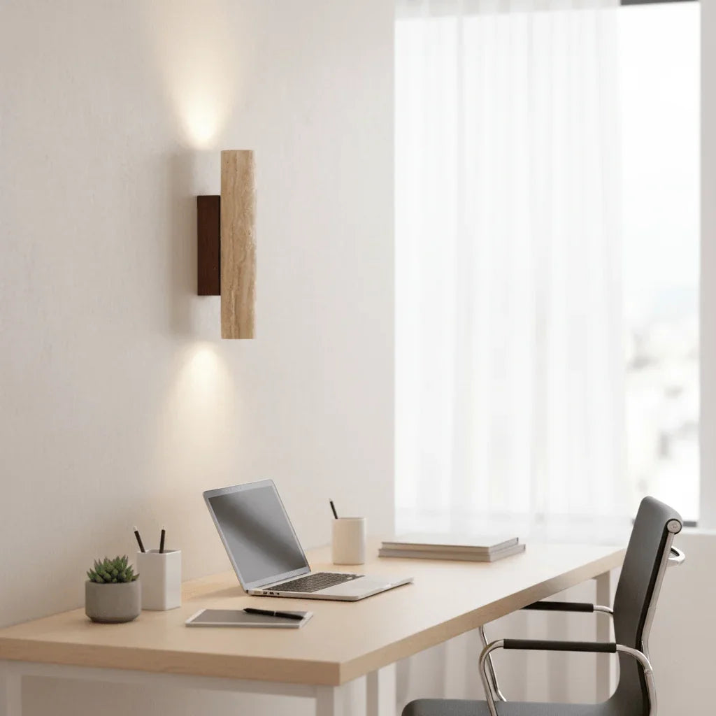 Travertine wall light above a desk