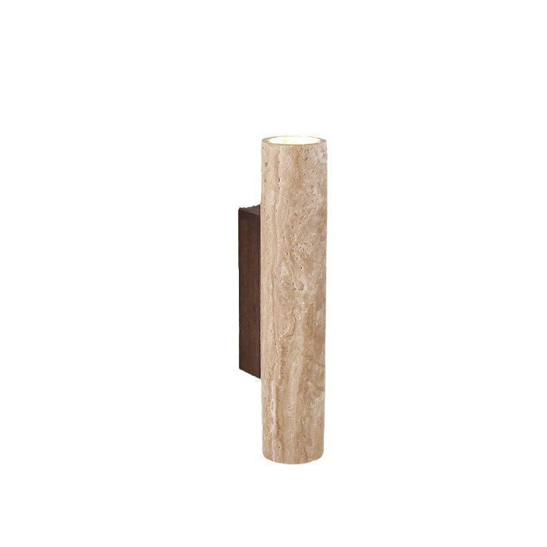 Tall travertine cylinder wall light on a white background
