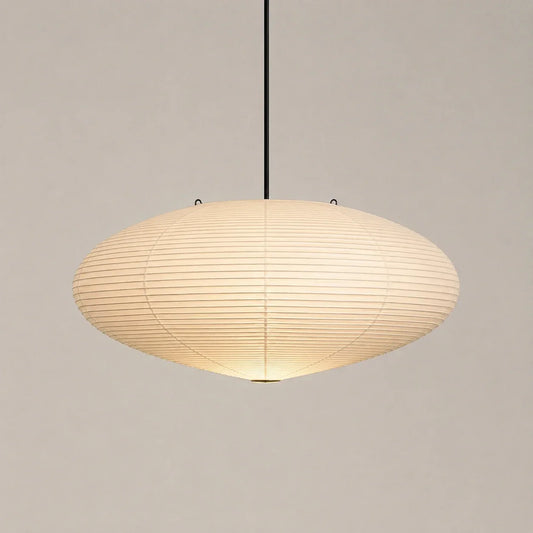 Minimalist Japanese oval rice paper pendant light measuring 45 by 25cm, featuring a warm glowing shade suspended from a slim black ceiling fixture.