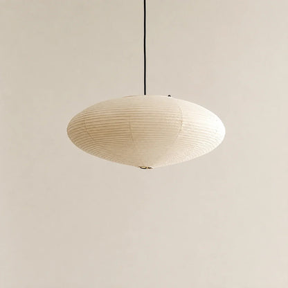 Minimalist Japanese oval pendant light crafted from textured white rice paper, hanging from a simple black cord against a neutral background.