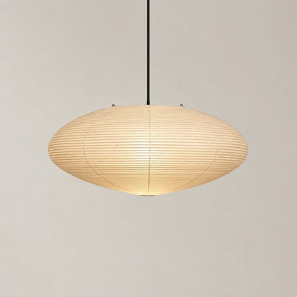 Minimalist Japanese oval pendant light featuring a textured cream rice paper shade suspended from a thin black cord against a neutral background.