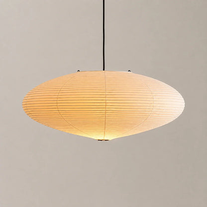 Minimalist oval rice paper pendant light with a warm glow, suspended by a black cord against a neutral background, perfect for Japandi interiors.