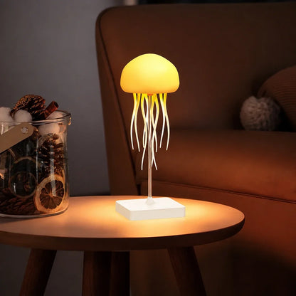 A jellyfish-shaped LED table lamp emitting a warm yellow glow on a wooden side table next to a decorative jar, creating a cosy ambient light.