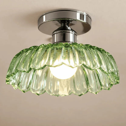 Close-up of petal-ribbed green glass ceiling shade