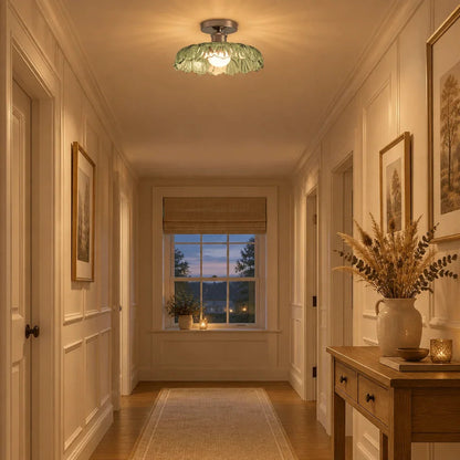 Green glass ceiling light in a hallway