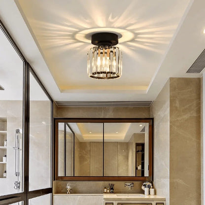 Round crystal ceiling light above a mirror