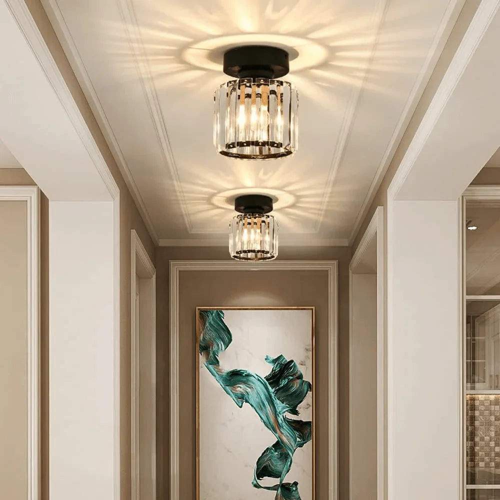 Pair of round crystal ceiling lights in a hallway