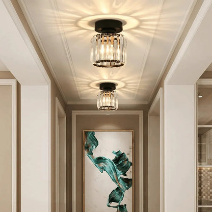 Pair of round crystal ceiling lights in a hallway