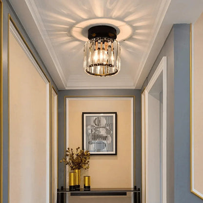Round crystal ceiling fitting above an entrance
