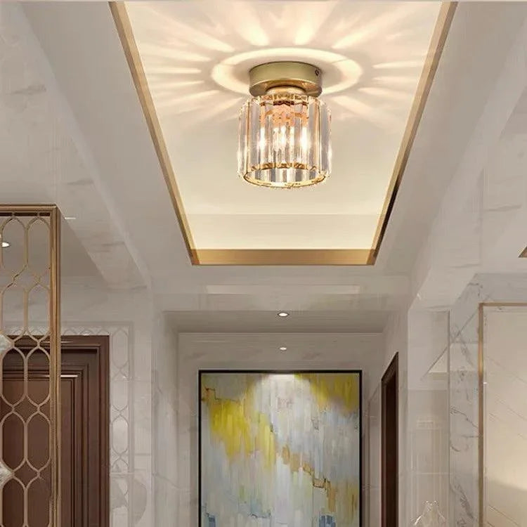 Gold round crystal ceiling light in a hallway
