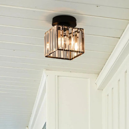 Square crystal ceiling fitting on a white ceiling