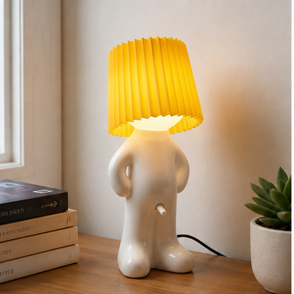 Yellow Larry lamp beside books