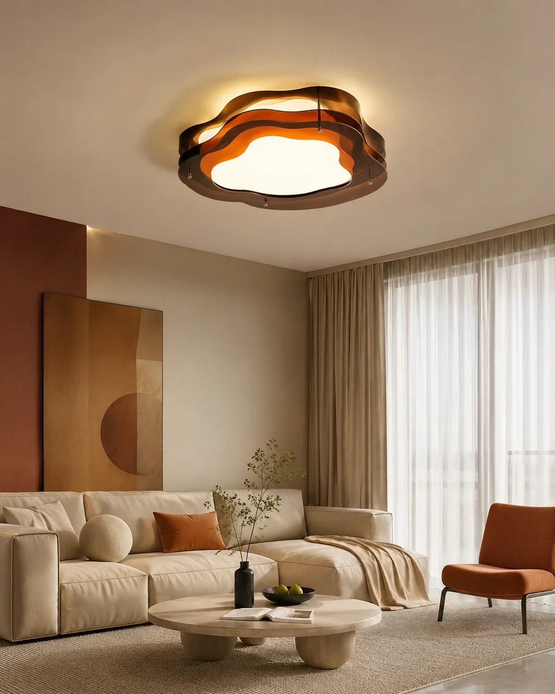 A modern layered LED ceiling light in a cloud shape, emitting a warm glow over a contemporary living room with a beige sofa and round coffee table.