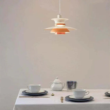 Orange and white pendant above a dining table
