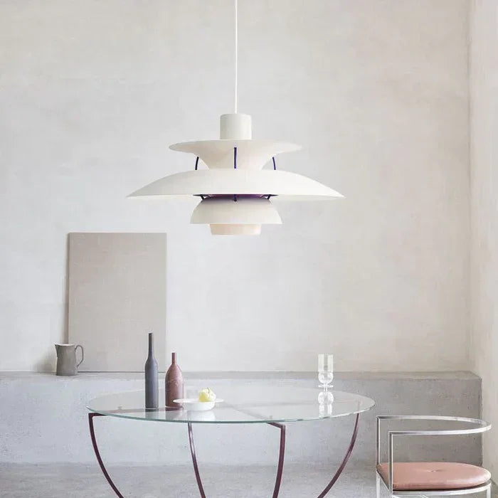 White and purple pendant above a glass dining table