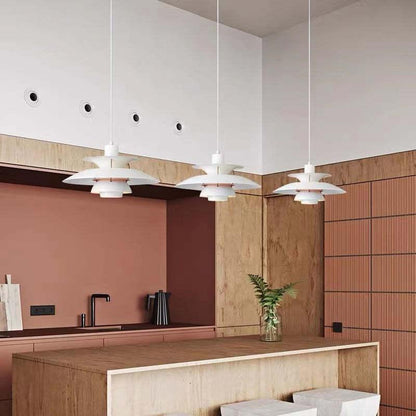 White layered pendants above a kitchen island