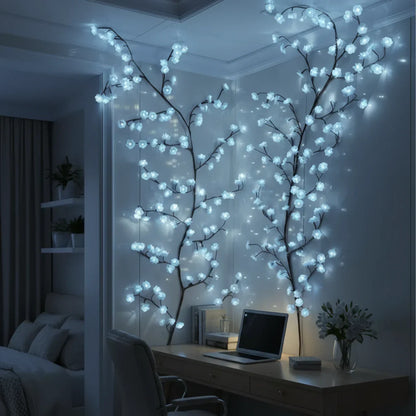 Blue LED cherry blossom branches on a bedroom wall