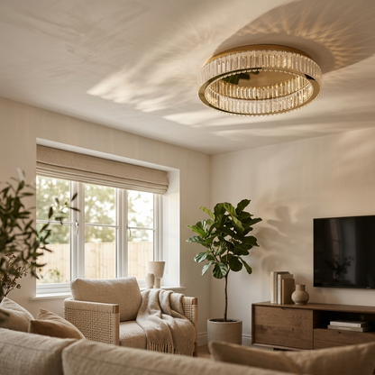 Gold flush mount crystal chandelier above an armchair