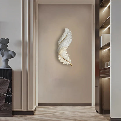 A vertical white LED feather wall lamp mounted on a neutral interior wall, providing soft ambient lighting in a modern hallway setting.
