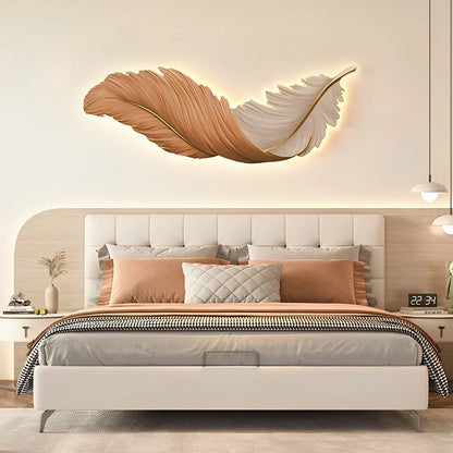 Horizontal orange and white LED feather wall lamp mounted above a modern bedroom headboard, providing soft ambient lighting for a stylish interior.