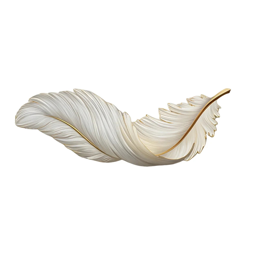 A decorative wall lamp shaped like a white feather with elegant gold detailing, designed for modern ambient lighting in a contemporary home interior.