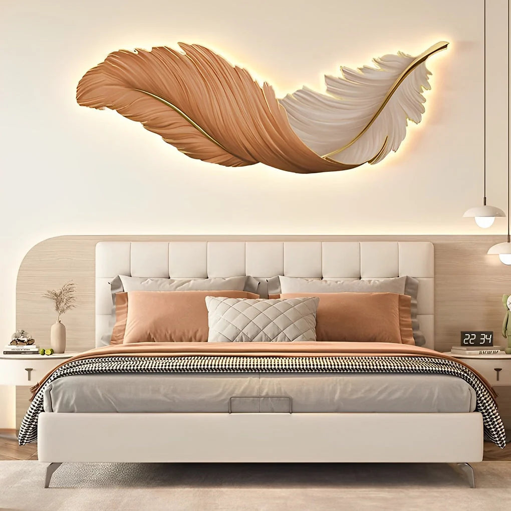 Modern LED feather wall lamp with warm ambient lighting mounted above a contemporary bedroom headboard, creating a stylish and cosy atmosphere.