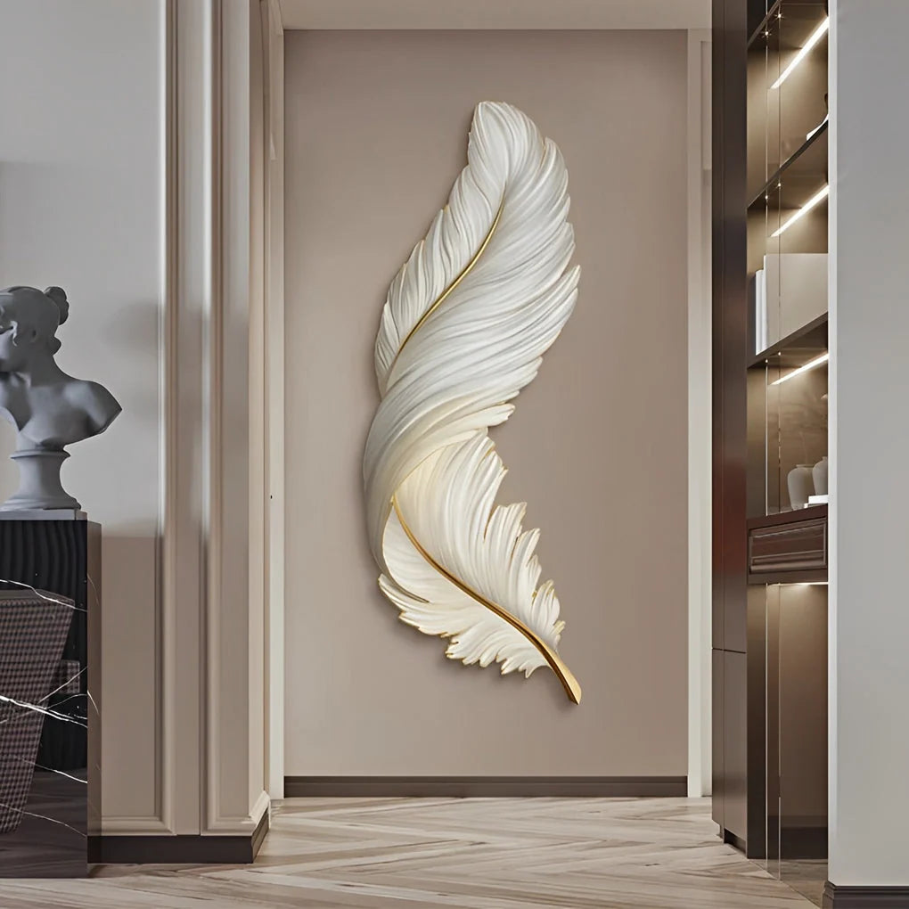 A large, elegant white feather-shaped LED wall lamp mounted on a neutral-toned hallway wall, providing soft ambient lighting in a modern interior.