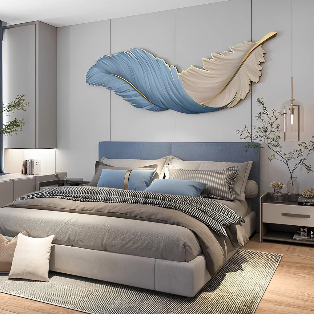 Horizontal blue and cream feather-shaped LED wall lamp mounted above a modern bedroom headboard, providing elegant ambient lighting for the room.