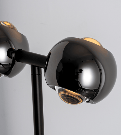 Close-up of the black chrome lamp heads and connecting bar