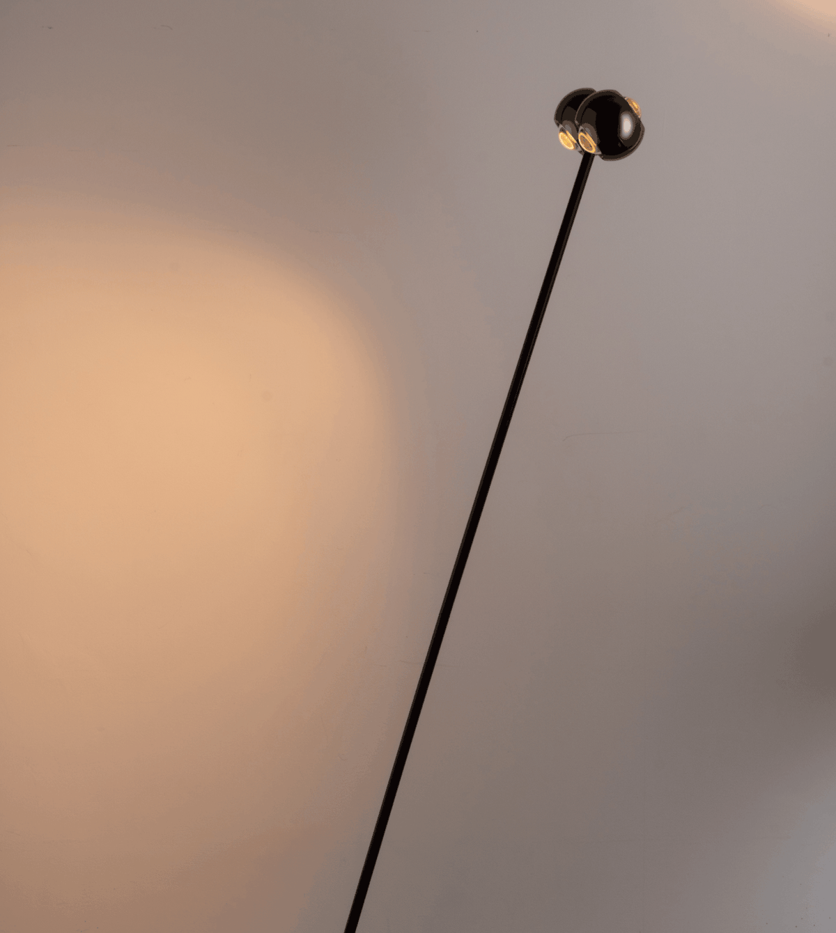 Angled view of the black chrome heads and slim stem