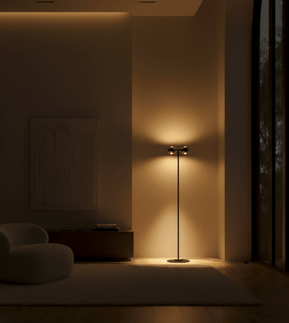 Twin-head floor lamp with two warm pools of wall light