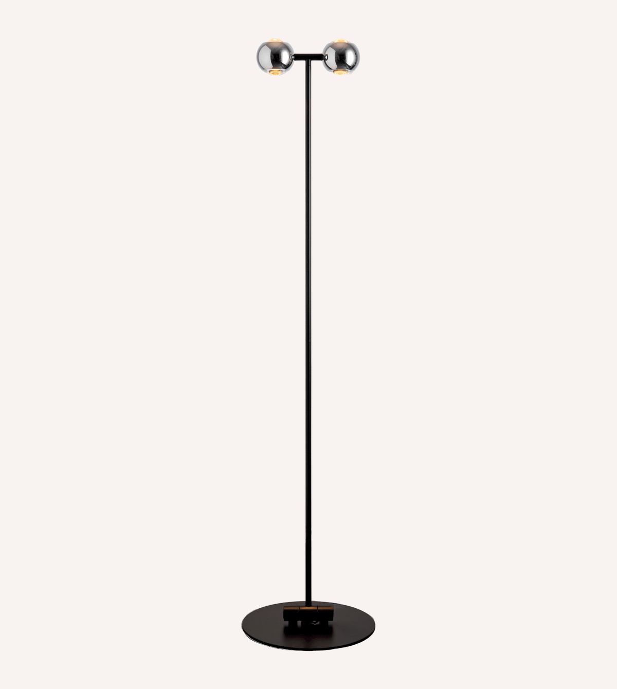 Full view of the twin-head floor lamp and circular base